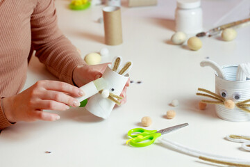 Obraz na płótnie Canvas Reuse concept art from toilet tube. Eco friendly bunny craft. Handmade decoration easter rabbit. Kids DIY ideas