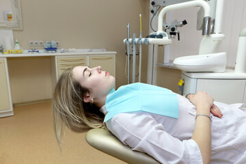  pretty woman in dentist chair waiting for treatment