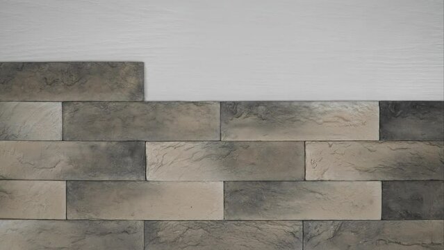 vintage brick. artificial stone imitating neat brickwork. clinker tiles for home renovation. construction and facing materials. Stop motion.