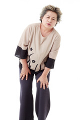 Isolated cutout studio shot Asian old senior sick injury retired gray short hair grandmother model in casual outfit standing holding hands on legs and knees has muscle ache pain on white background