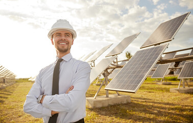 Positive male investor on solar farm