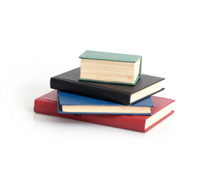 Stack of red, black, blue and green on a white background.