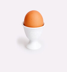 Egg in the egg stand isolated on a white background. Design element with clipping path