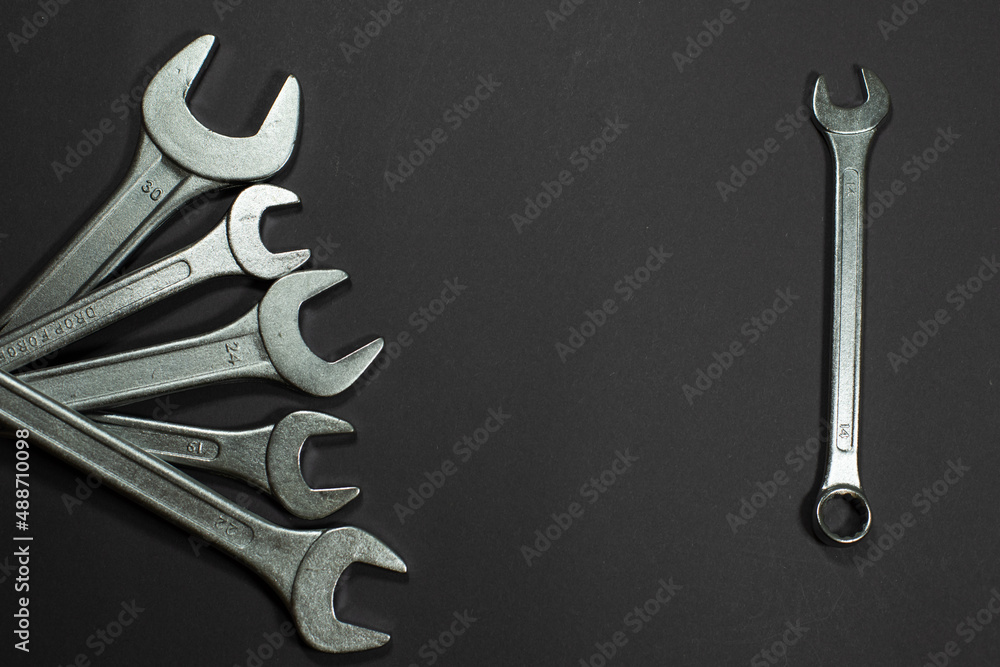 Wall mural wrenches on a black background