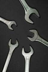 wrenches on a black background