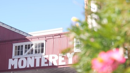 Cannery row in Monterey city, California tourist landmark, USA. Historic fisherman wharf, famous retro industrial street with canning companies and sardines factory. Travel destination or sightseeing.