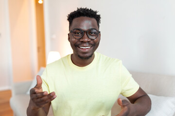 Online tutoring, teaching, remote distant work. African man freelancer father on video call...