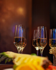 Many glasses of champagne and fruit