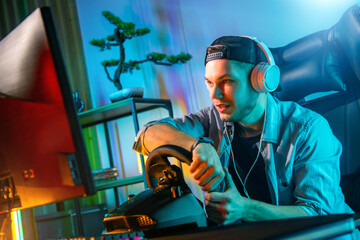 Pro Gamer Man playing computer games. Car Racing Online Video Game