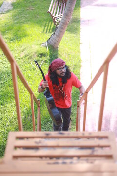long haired gypsy climbing on a ladder