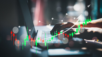 Financial technology and investment ideas with stock markets and mutual funds. Man analyzing financial data with graph trading from laptop at home.