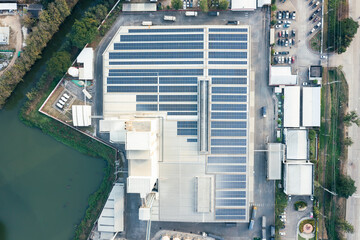 Eco building or factory in aerial view consist of solar or photovoltaic cell in panel on top of...