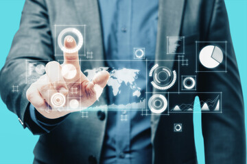 Close up of man hand pointing at abstract digital business interface on blurry blue background. Technology, finance, success, economy and growth concept. Double exposure.