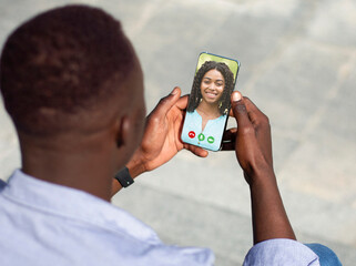 Young African American Man Making Video Call With Smartphone To His Girflriend
