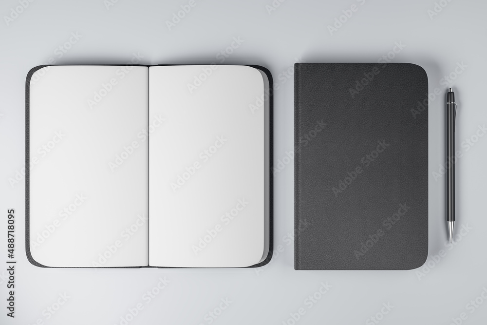 Poster top view on notebooks with black cover and blank white pages and black pen near on light background.