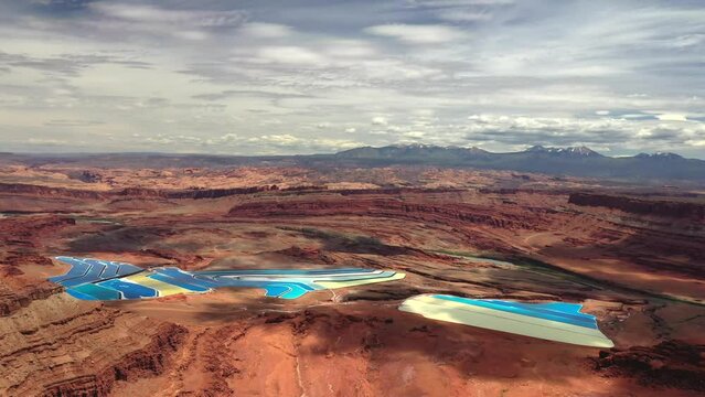 Potash Evaporation Ponds And Cliffs In Moab, Utah - aerial drone shot