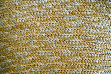 Closeup shot of Asian oriental traditional handicraft handmade organic brown weaving structure bamboo wooden rattan basket pattern texture background. Row of wood material wicker surface wallpaper