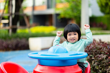 Funniest moment little boy in playground. Cute boy having fun playing outdoor activity and climbing in backyard. Developing children's learning before entering kindergarten