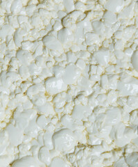 Curd background, texture. Close-up of fresh cottage cheese. Big DOP. the process of making cheese at one of the stages, granular cottage cheese. Technology for making soft cheese at home. copy space