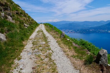 Old military road in the mountains above Lake Maggiore offering splendid views. Lombardy, Italy.