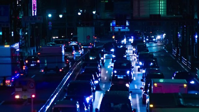 A night timelapse of the traffic jam on the city street in Tokyo long shot
