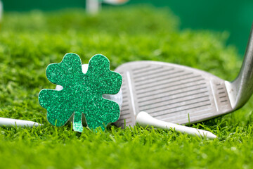 Golf ball for St. Patrick's Day on green grass. St. Patrick's Day is celebrated annually on March 17, the anniversary of his death in the fifth century. The Irish have observed this day as a religious