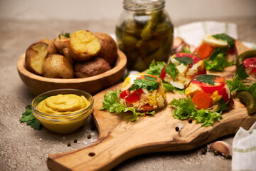 Portion of delicious chicken aspic on serving board on concrete table