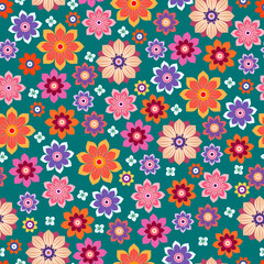 Floral seamless background. Various flowers and leaves on a green background.