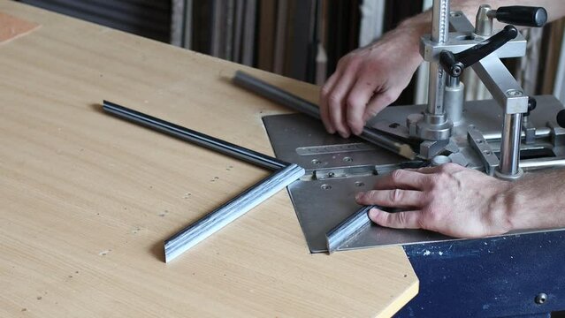 Framing Workshop. Making staples corners brackets baguette handmade picture frame at studio.