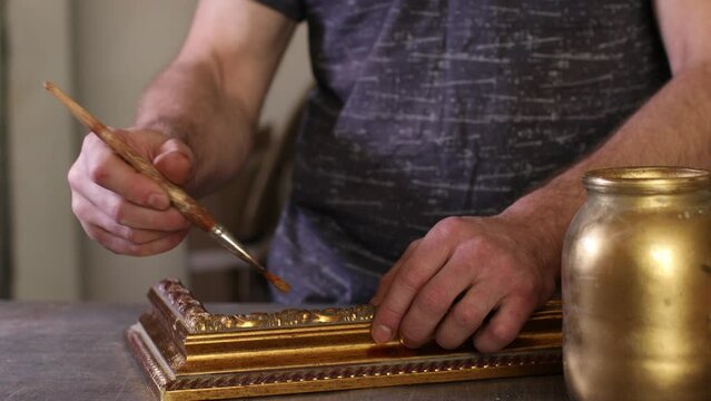 Framing Workshop. Painting baguette handmade picture frame at studio.