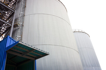 Silo Metal Sheet container settles on the ground with white background. © Surachetsh