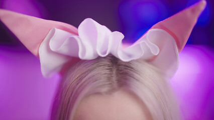 Blonde female person put on cat ears maid headband cosplay close-up - obrazy, fototapety, plakaty