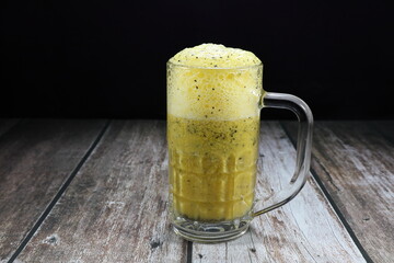 Fresh and organic Passion fruit juicy mixed with soda serving in the glass. Famous tropical fruit...