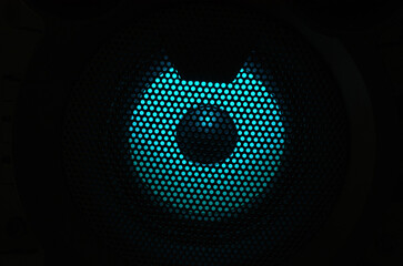 Music speaker with blue backlight close-up