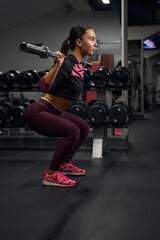 Fototapeta na wymiar Profile photo of sportswoman lifting heavy weights