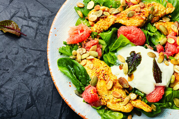 Spring salad of chicken breast and citrus fruits.