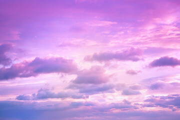 Pink purple sky with clouds. Beautiful sunset. Delicate background for design.