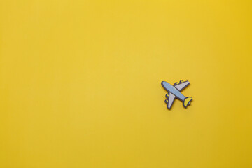 Toy plane on a yellow background