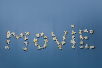 Movie inscription from popcorn on a blue background