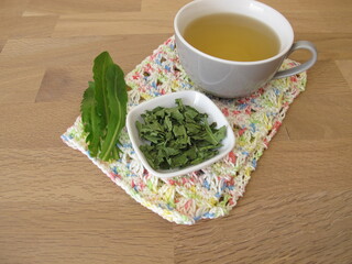 Homemade dandelion tea, tea with dried dandelion herb