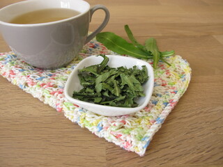 Homemade dandelion tea, tea with dried dandelion herb