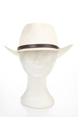 Mannequin head wearing straw hat isolated on white background, front headshot
