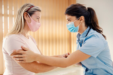Fototapeta premium A female doctor talking to a patient in doctor's office. 