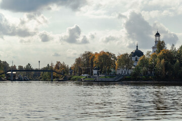 View from the water to the Church of the Holy Blessed Grand Duke Alexander Nevsky in Ust-Izhora in autumn. Boat trip. Russia, St. Petersburg, September 30, 2020.