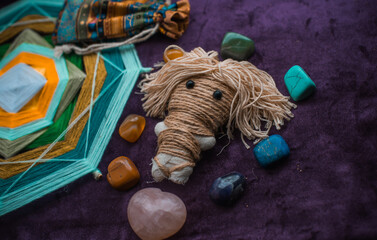 Concept of pagan magic, voodoo. Magical handmade doll .Witchcraft with a doll. 