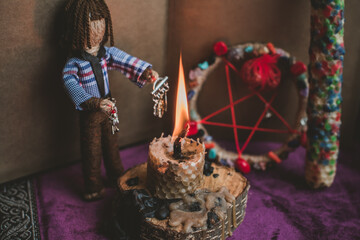 Concept of pagan magic, voodoo. Magical handmade doll .Witchcraft with a doll. 