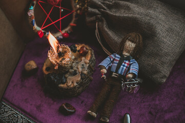 Concept of pagan magic, voodoo. Magical handmade doll .Witchcraft with a doll. 