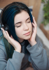 Fototapeta premium Happy teenager listening to music