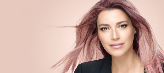 Gorgeous woman with rose gold ombre hairstyle. Beauty with nude makeup and flying smooth hair. Fashion hairstyle, hair color and beauty salon concept. Panorama banner isolated on white