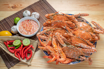 Seafood dish, steamed and cooked blue crab, served with Thai spicy and sour seafood dipping sauce.